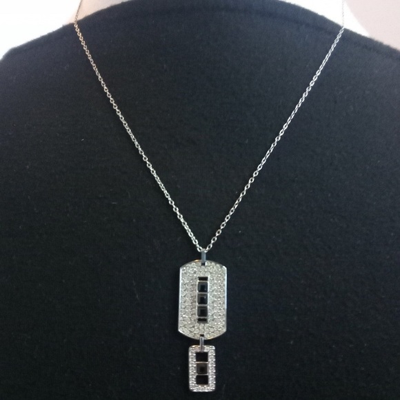 Swarovski black and white crystals pendant necklace in silver tone setting. 16”